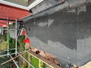 Flat roof balcony on scaffold